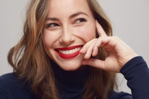 woman smiling with red lipstick