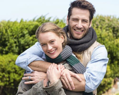 couple-embracing-outdoors-web