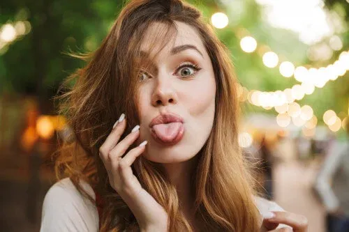 a woman sticking her tongue out