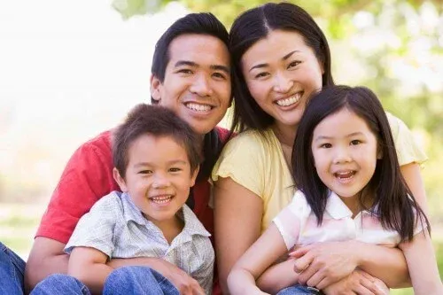 smiling-family-mom-dad-daughter-son-web