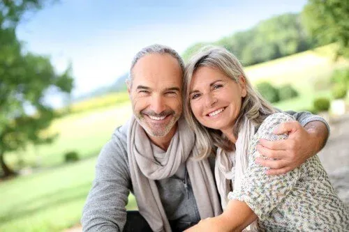 older-couple-embracing-outdoors